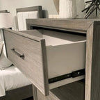 Ennesley Gray Wood Bedroom Set with Upholstered Panel Bed, Dresser, Mirror, Nightstand, and Chest